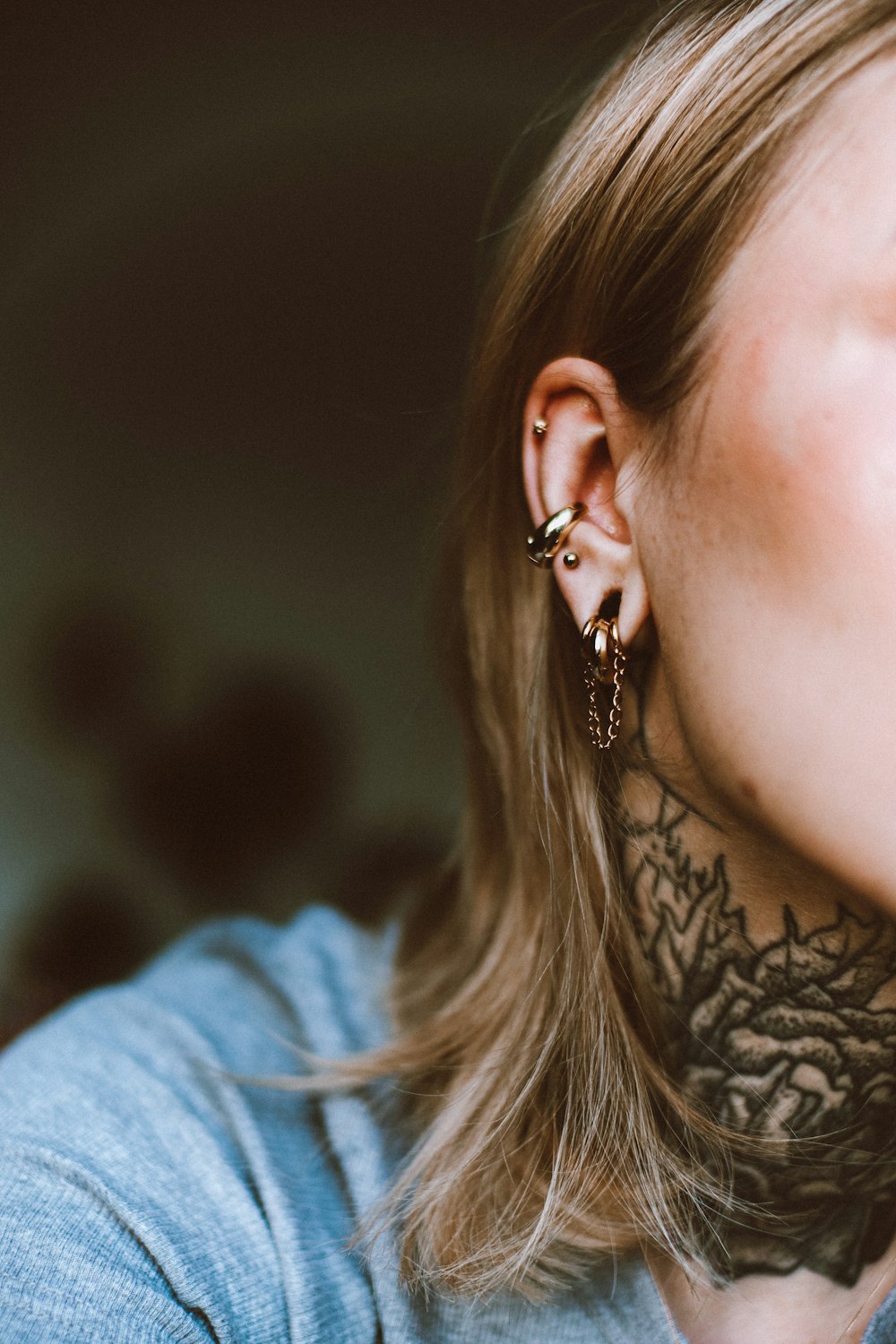 a woman with a tattoo on her neck