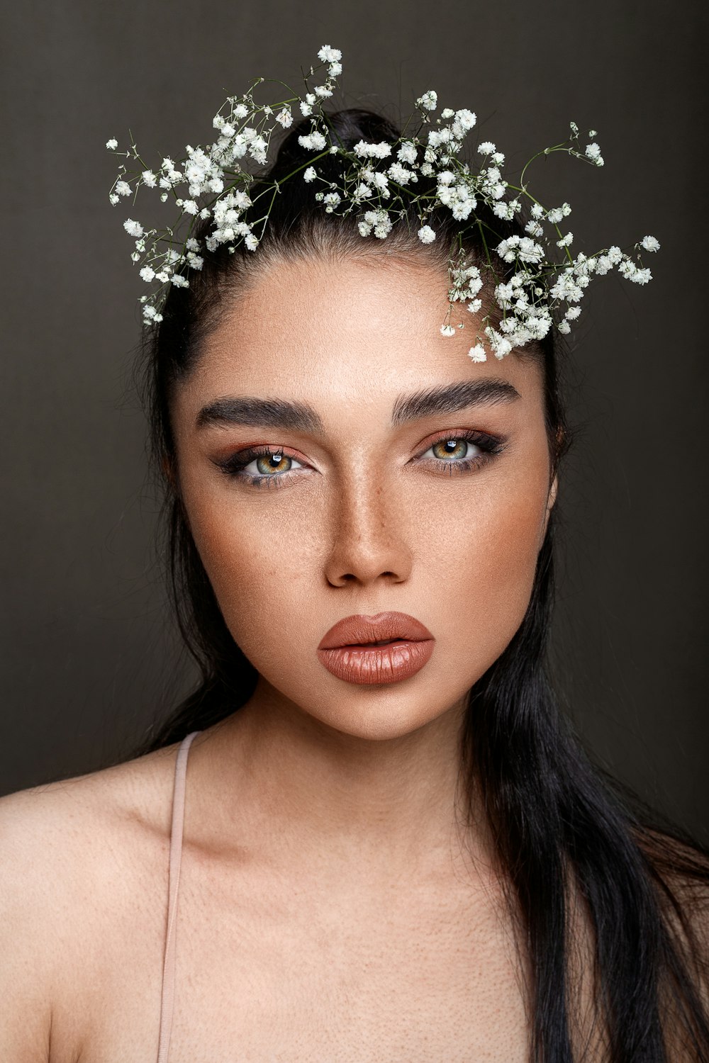 a woman with a flower crown on her head