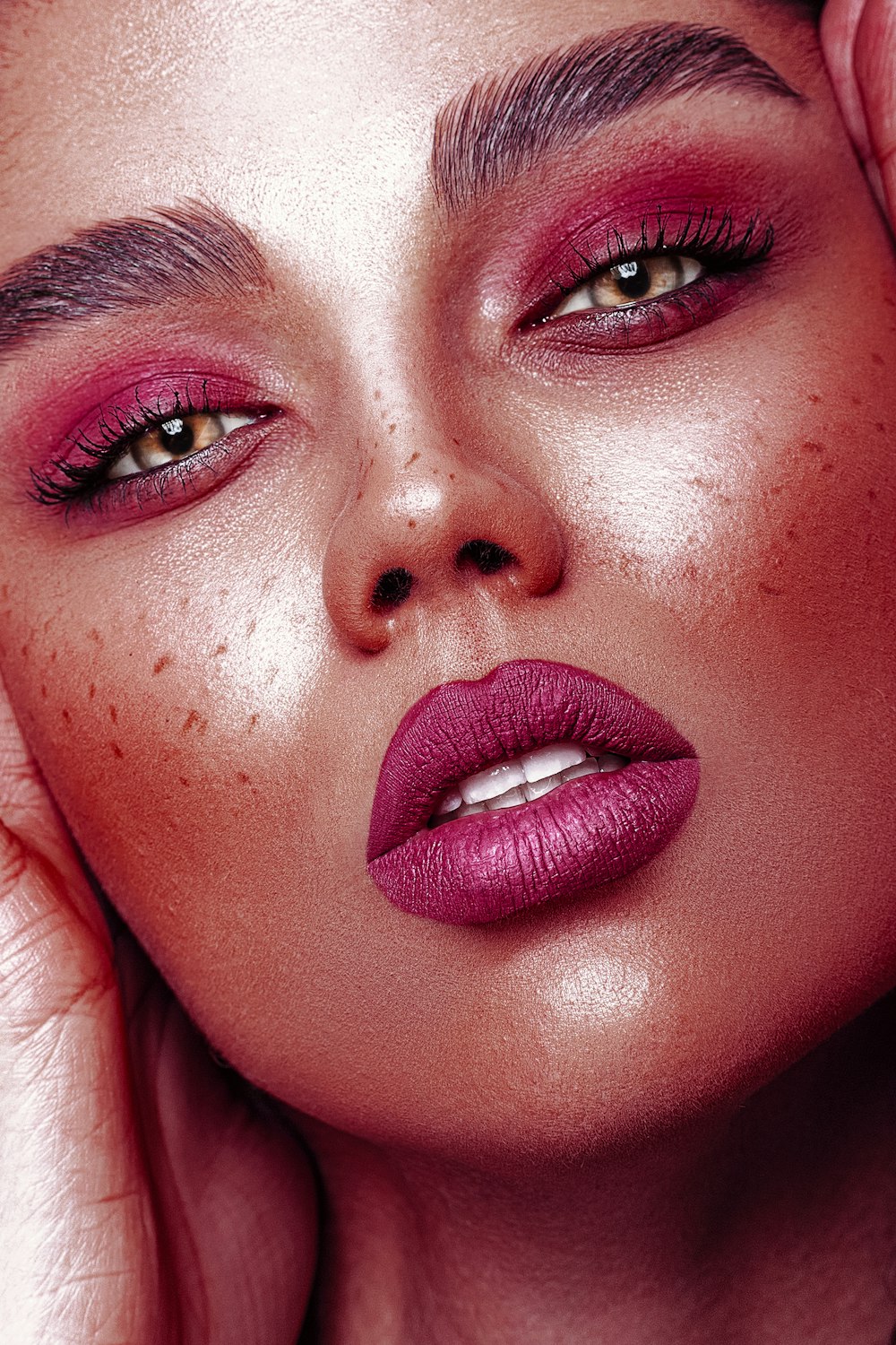 a close up of a woman with red lipstick