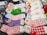 A variety of colorful socks featuring popular cartoon characters are neatly arranged in stacks. These socks include a variety of designs, each showcasing different characters and themes. The designs display playful and cute motifs with vibrant patterns.