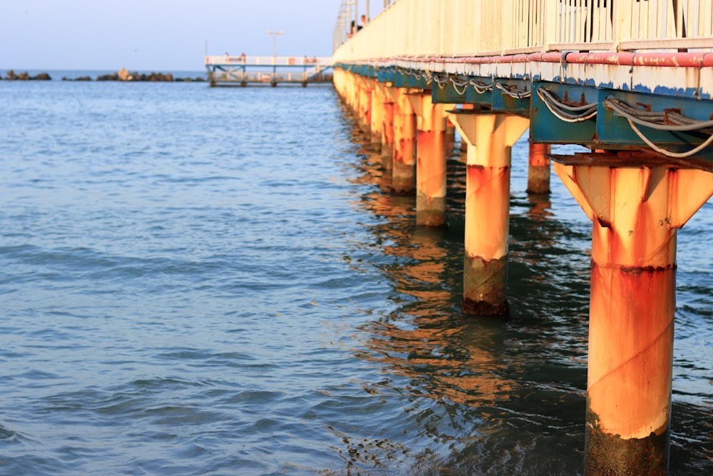 a pier with a boat tied to it's side