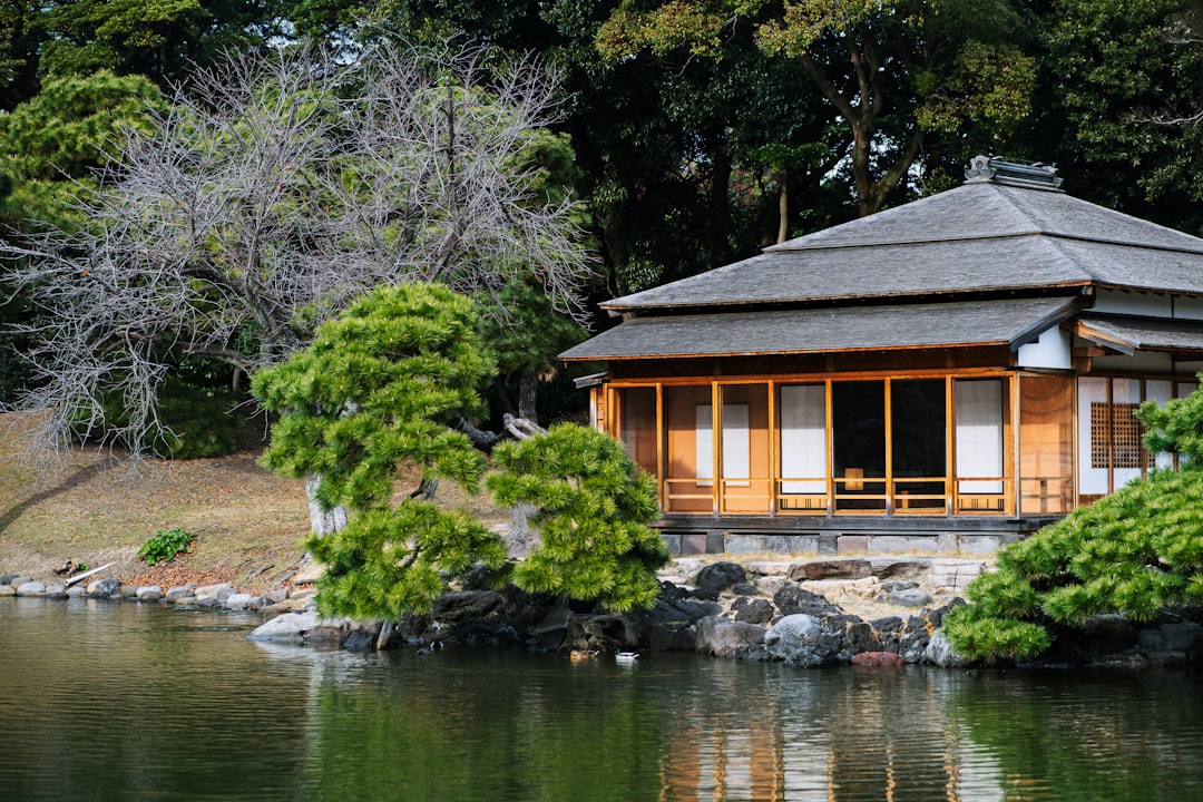 a small building sitting on top of a lake,
