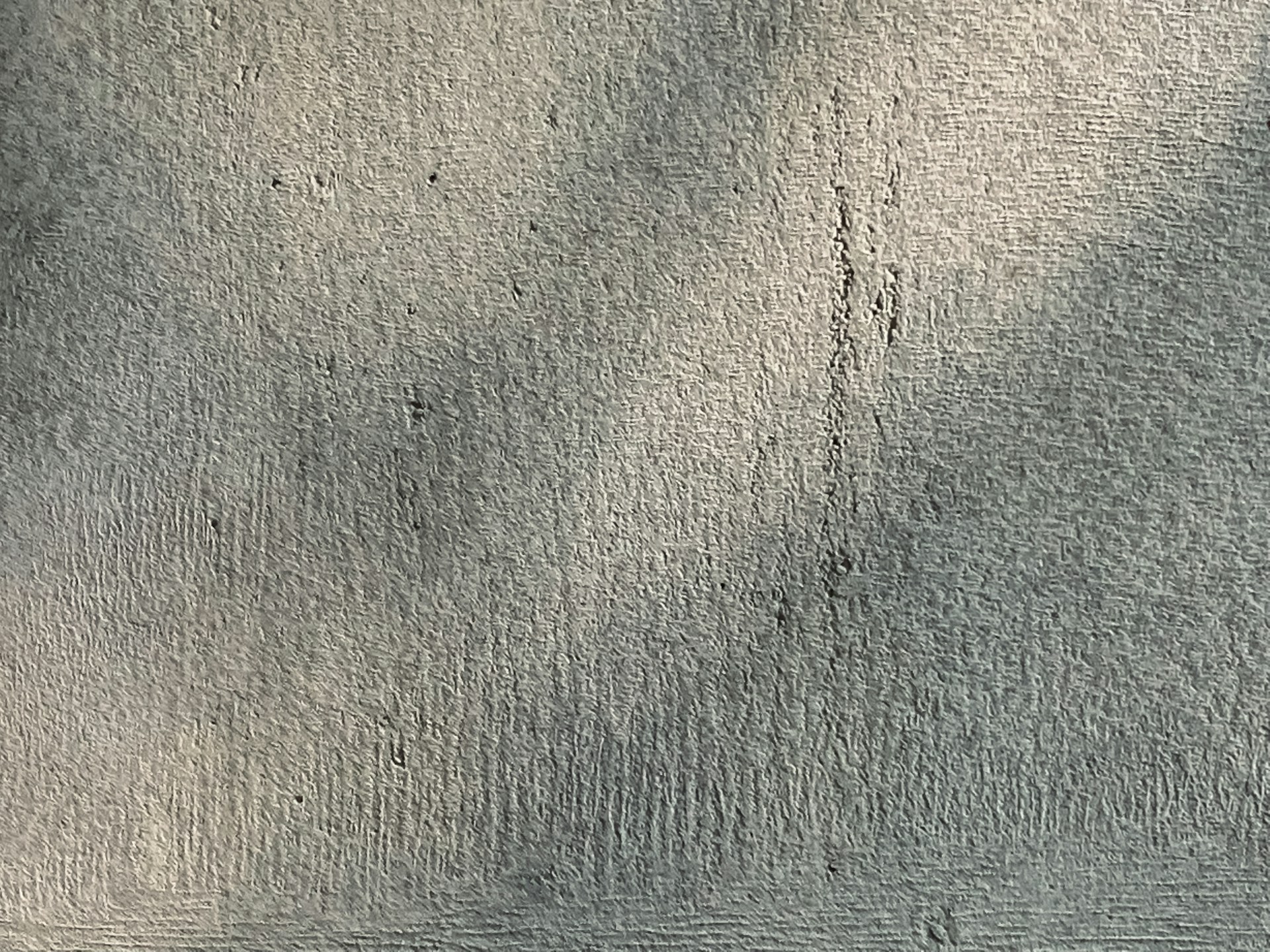 a black and white photo of a concrete wall