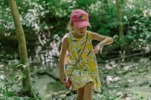 A happy child exploring outdoors wearing a minimalistic, comfortable outfit from soelun.