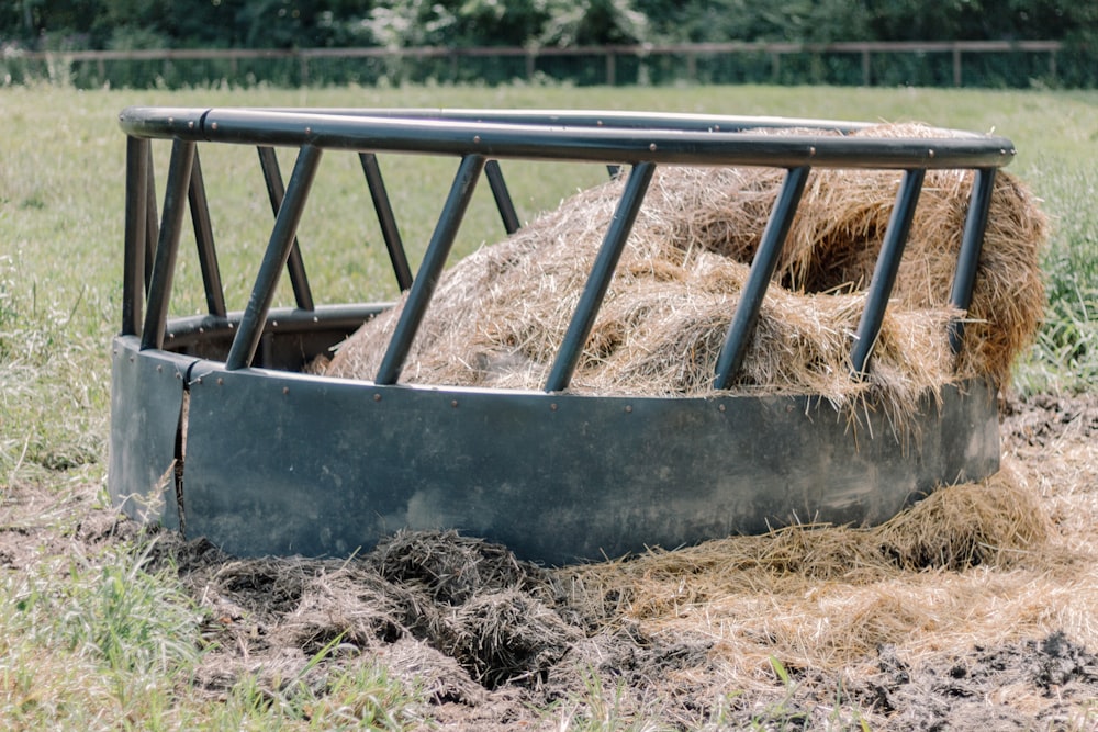 a hay bale in the middle of a field