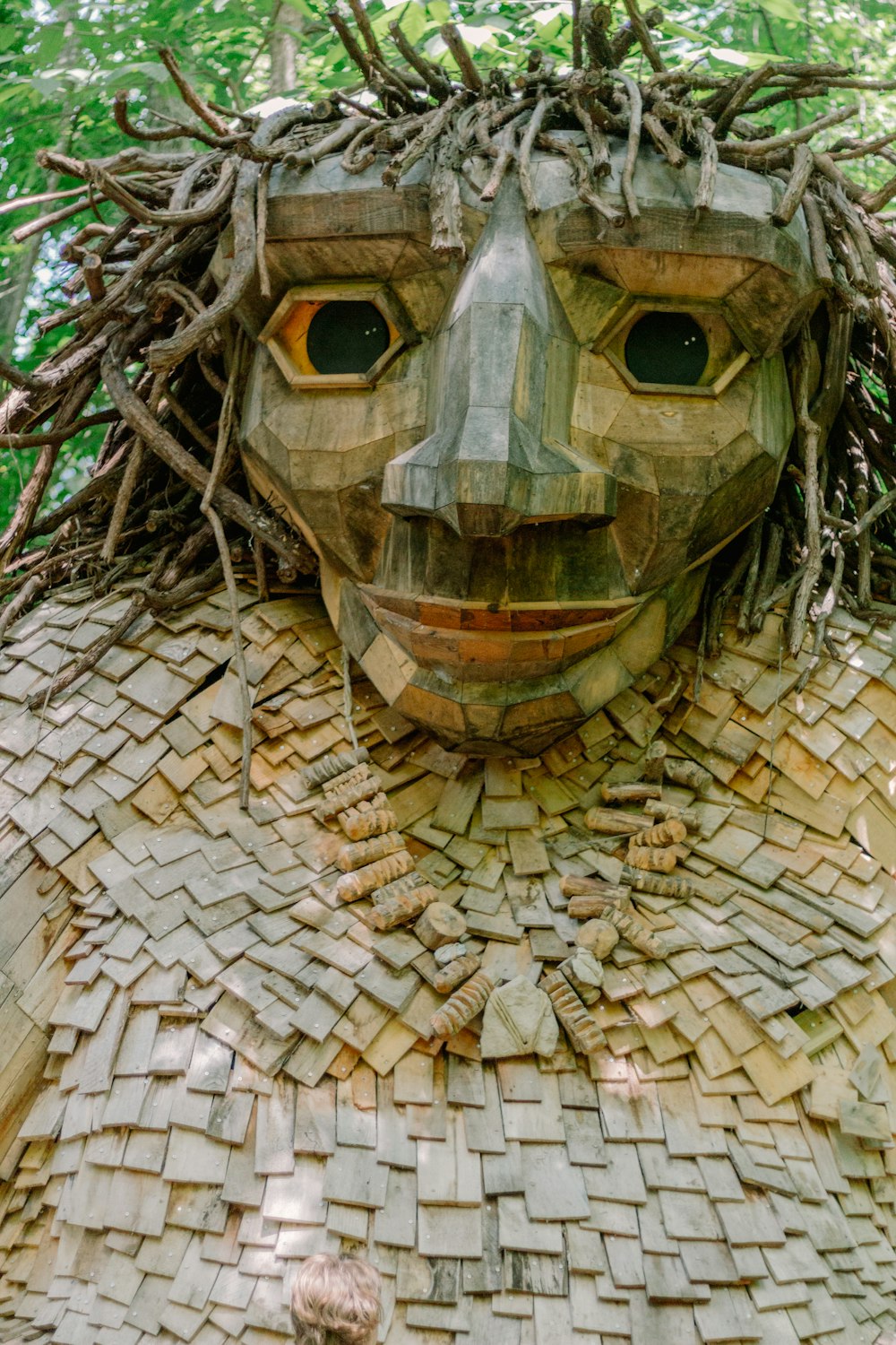 a sculpture of a man made out of bricks