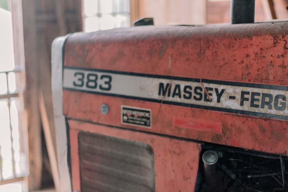 a close up of a red machine in a room