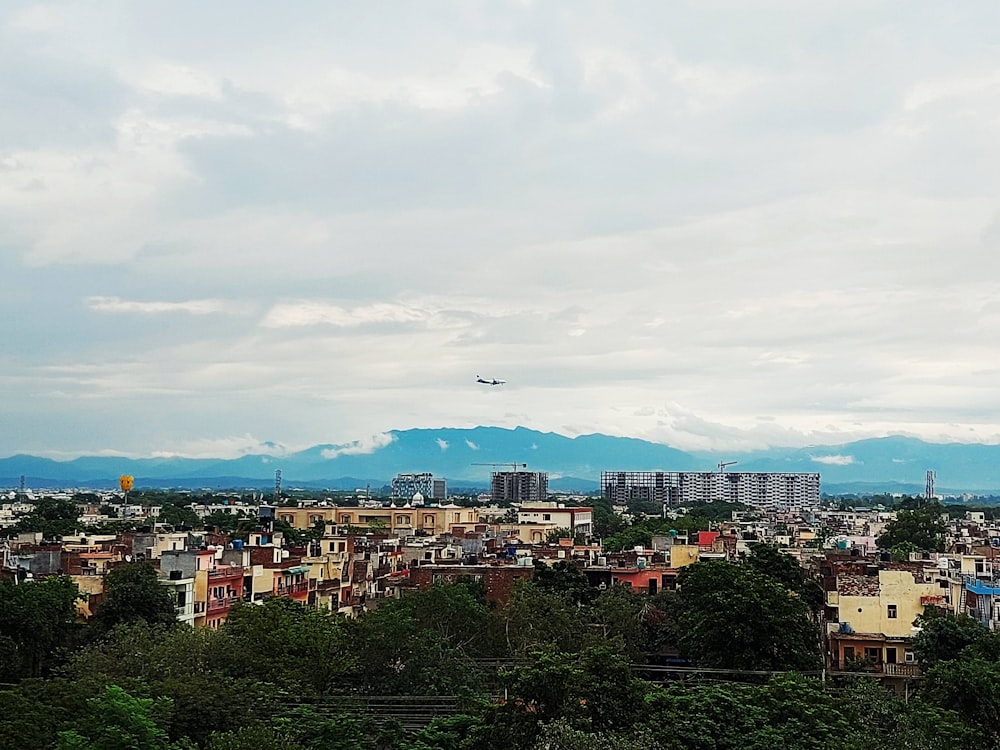 a view of a city with mountains in the background