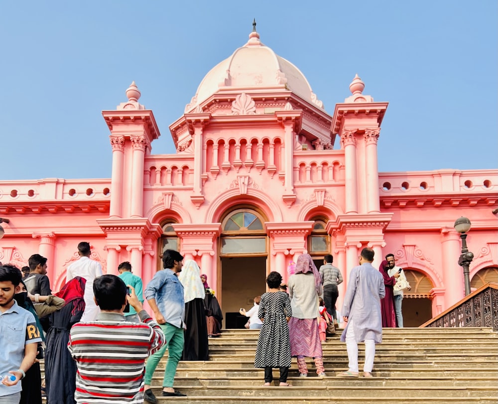 a group of people walking up a flight of stairs