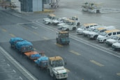 A fleet of transport vehicles lined up ready for departure.