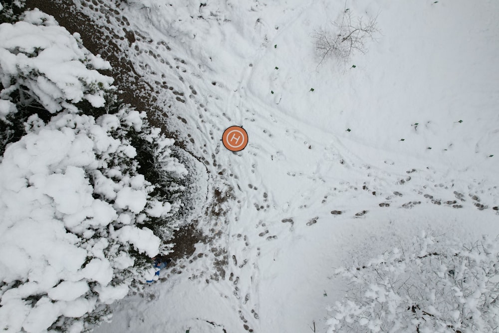 an aerial view of a snow covered field