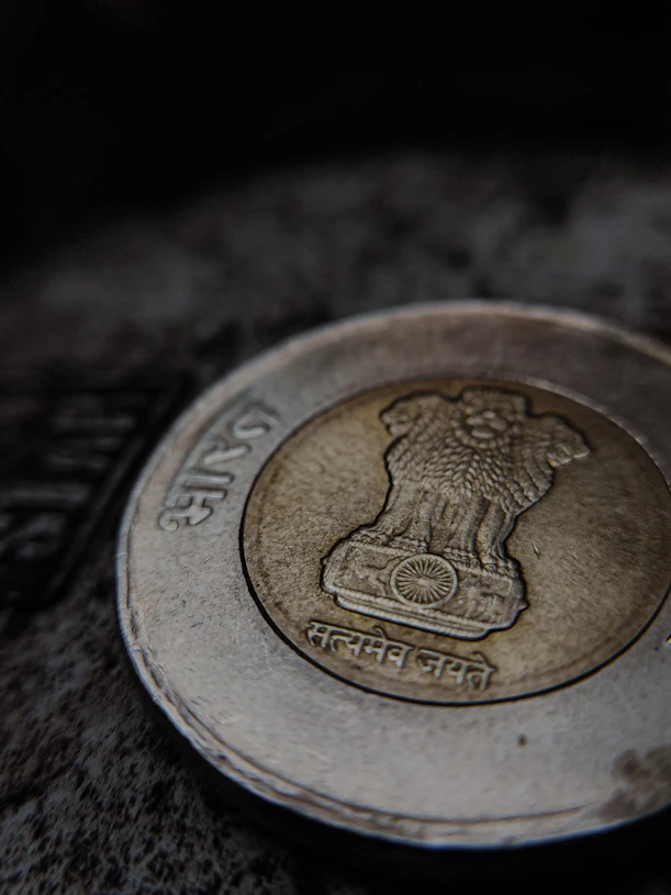 a close up of a one rupee coin