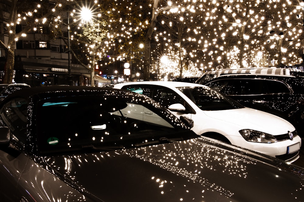 a group of cars parked next to each other on a street