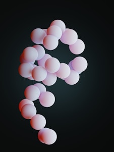 a group of pink balls floating in the air