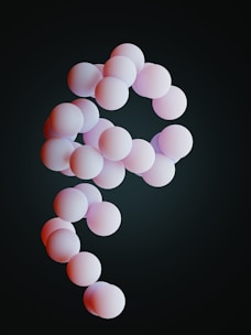 a group of pink balls floating in the air