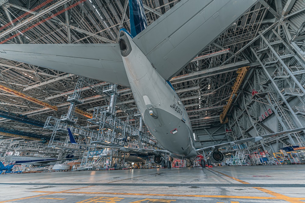 a large jetliner sitting inside of a hangar