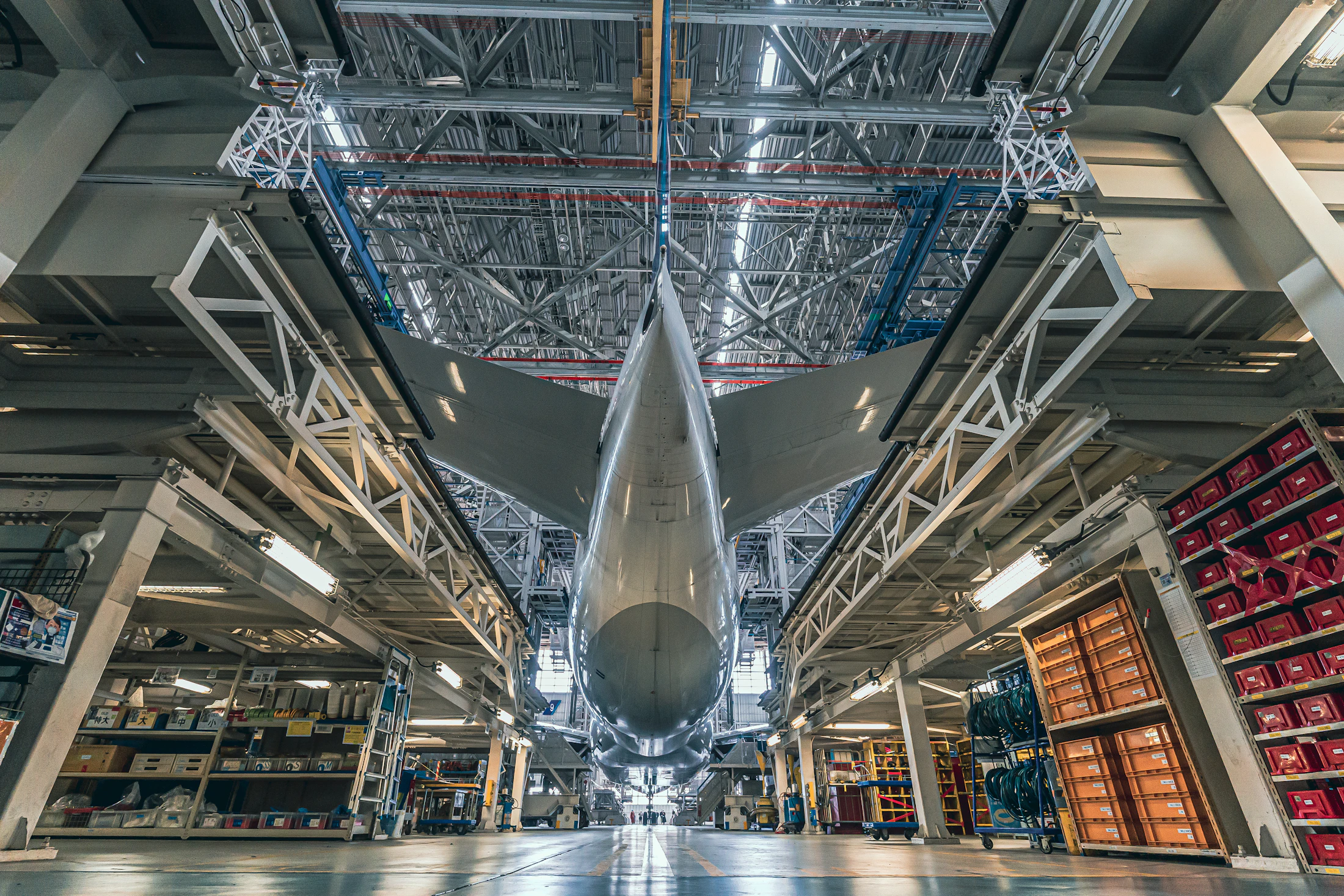 Modern jetliner inside an aircraft hangar