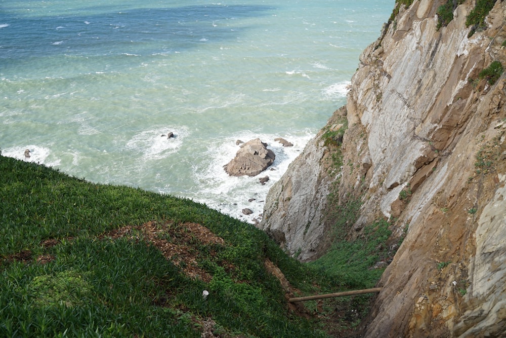 a view of the ocean from the top of a cliff