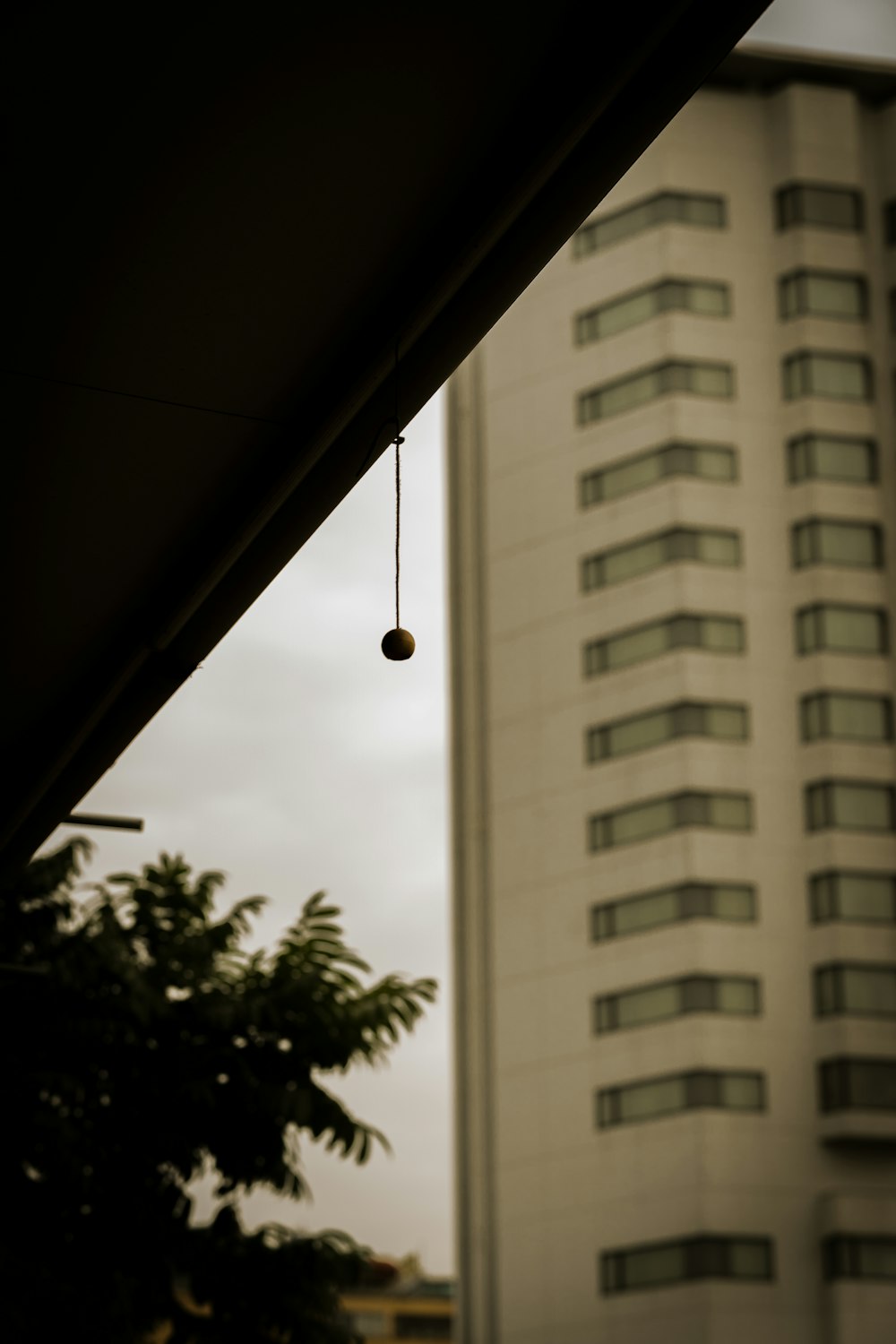 a tall white building with a clock on it's side