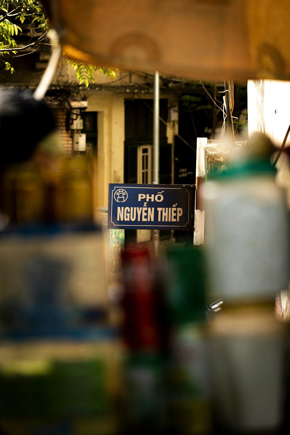 a sign that is on a pole in the street