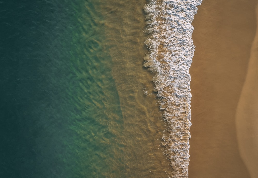 an aerial view of a beach and ocean