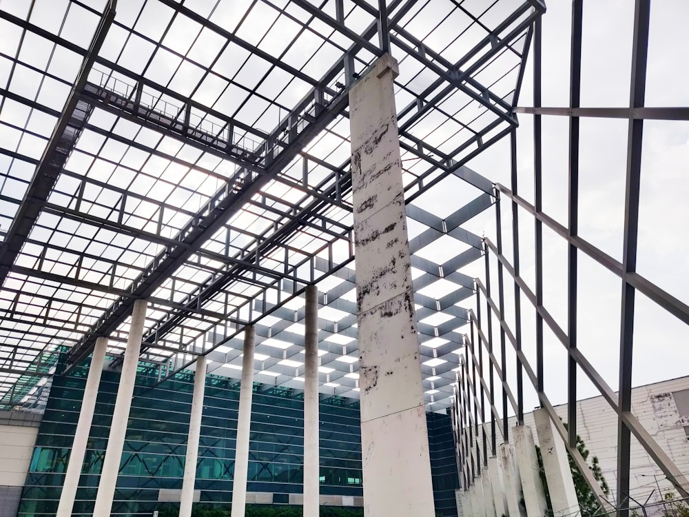 a large building with a metal roof and white columns