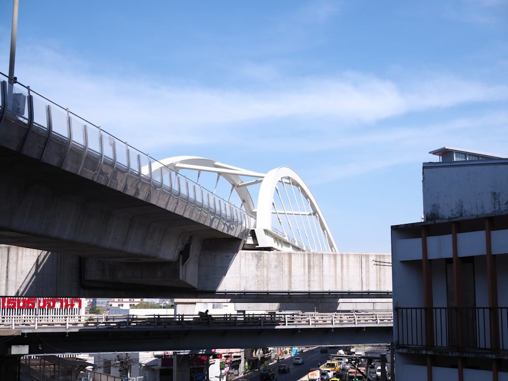 a bridge over a street with a sky background