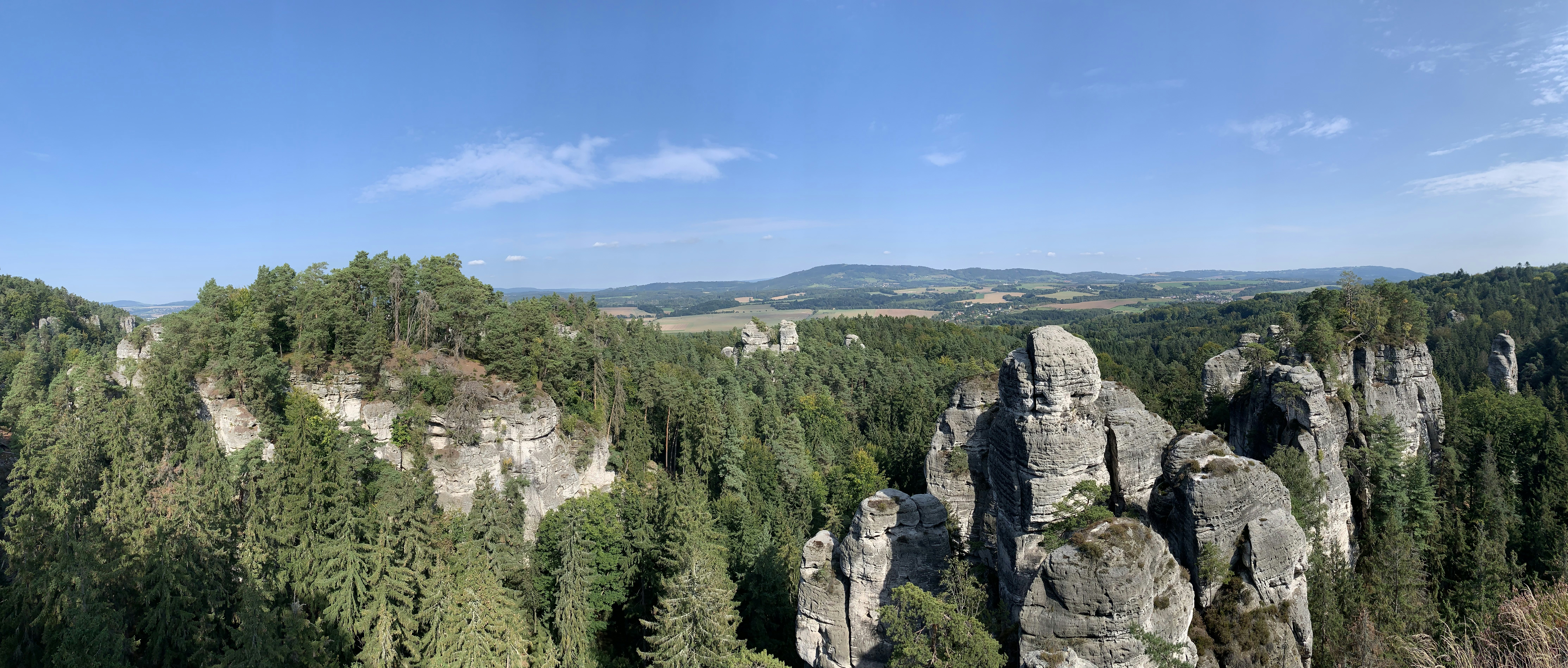 a scenic view of the mountains and trees