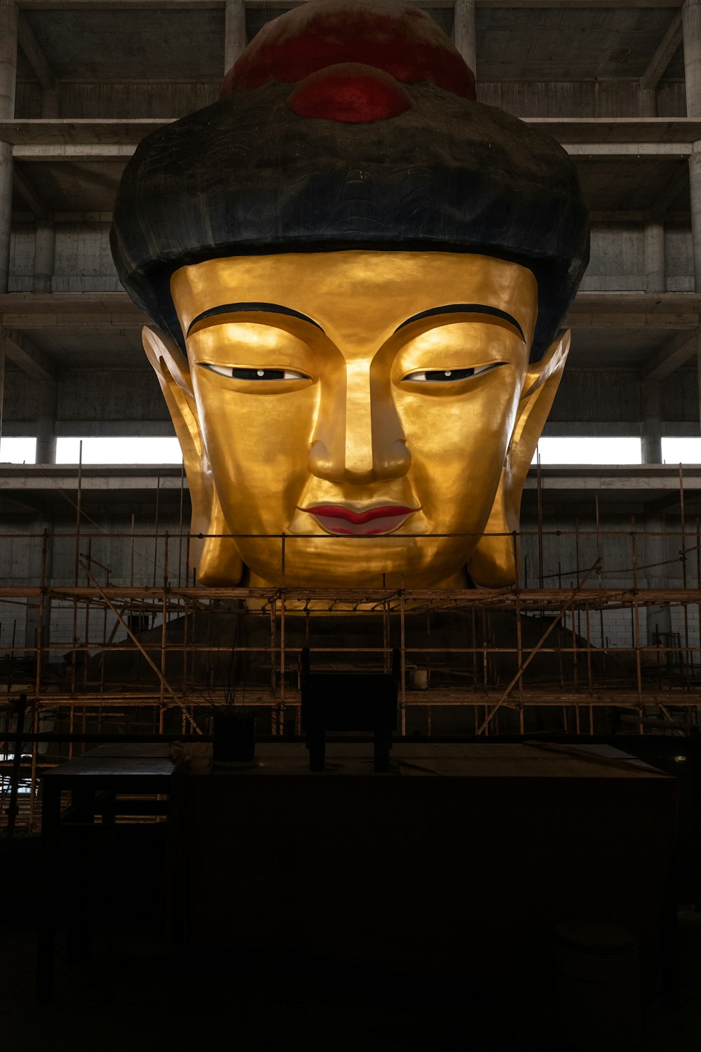 a large golden buddha statue in a large building