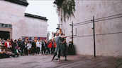 An audience engaged in a contemporary dance performance, captivated by the artistry on stage.
