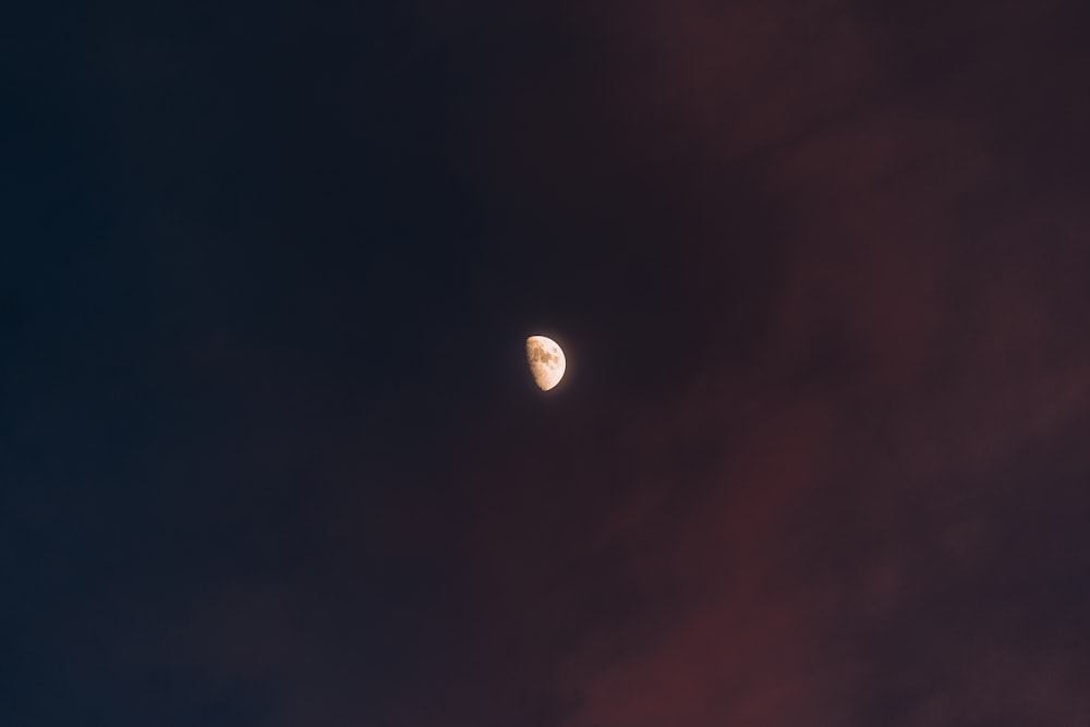 a view of the moon through the clouds
