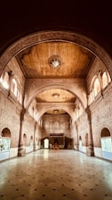 a large hall with a clock on the ceiling