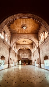 a large hall with a clock on the ceiling
