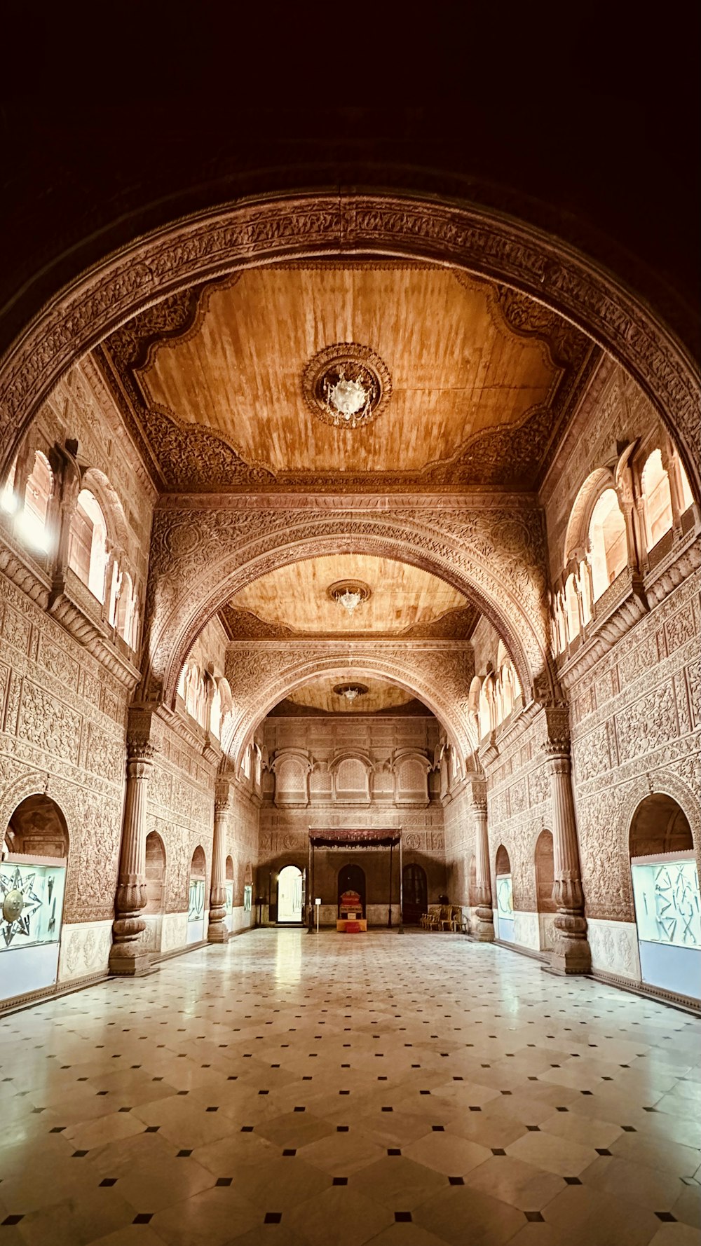 a large hall with a clock on the ceiling