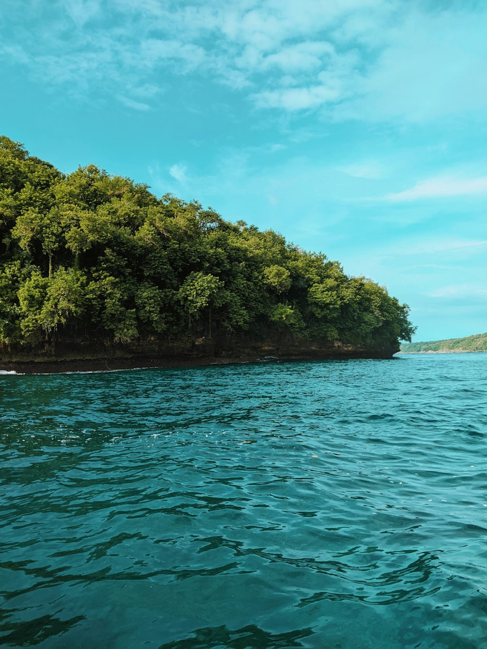 a person in a kayak in the middle of a body of water