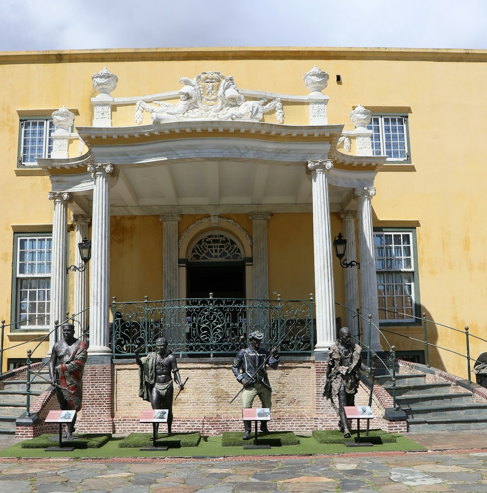 statues of soldiers in front of a building