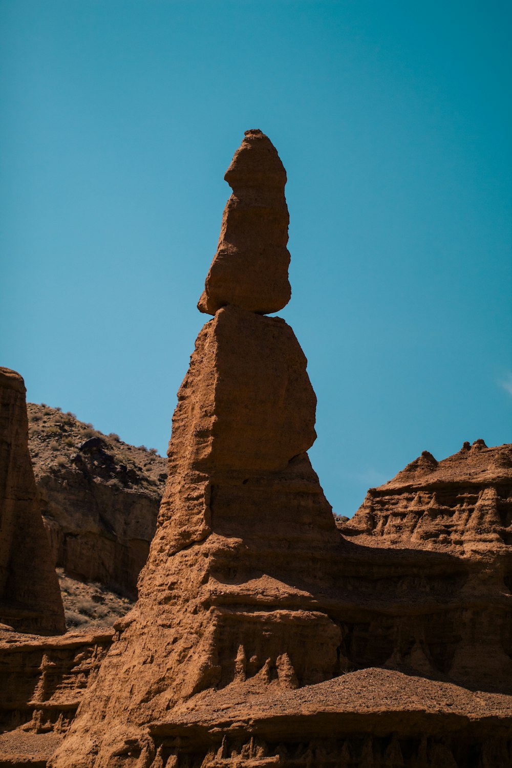 a rock formation in the middle of a desert