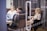 A professional office setting with employees engaged in a conference call.