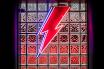 A colorful lightning bolt mascot with a playful, retro vibe.