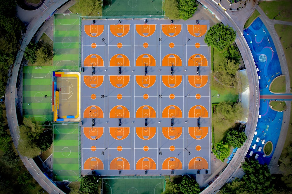 an aerial view of a basketball court surrounded by trees