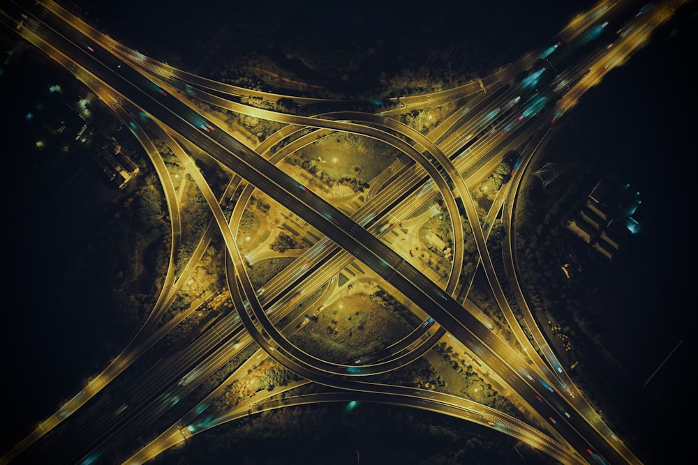 an aerial view of a street intersection at night