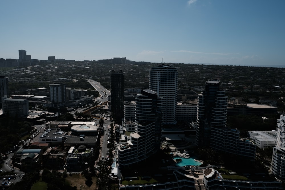 an aerial view of a city with tall buildings