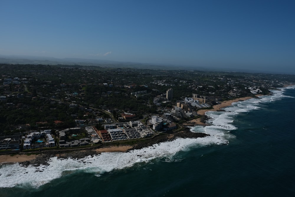 a bird's eye view of a beach and ocean