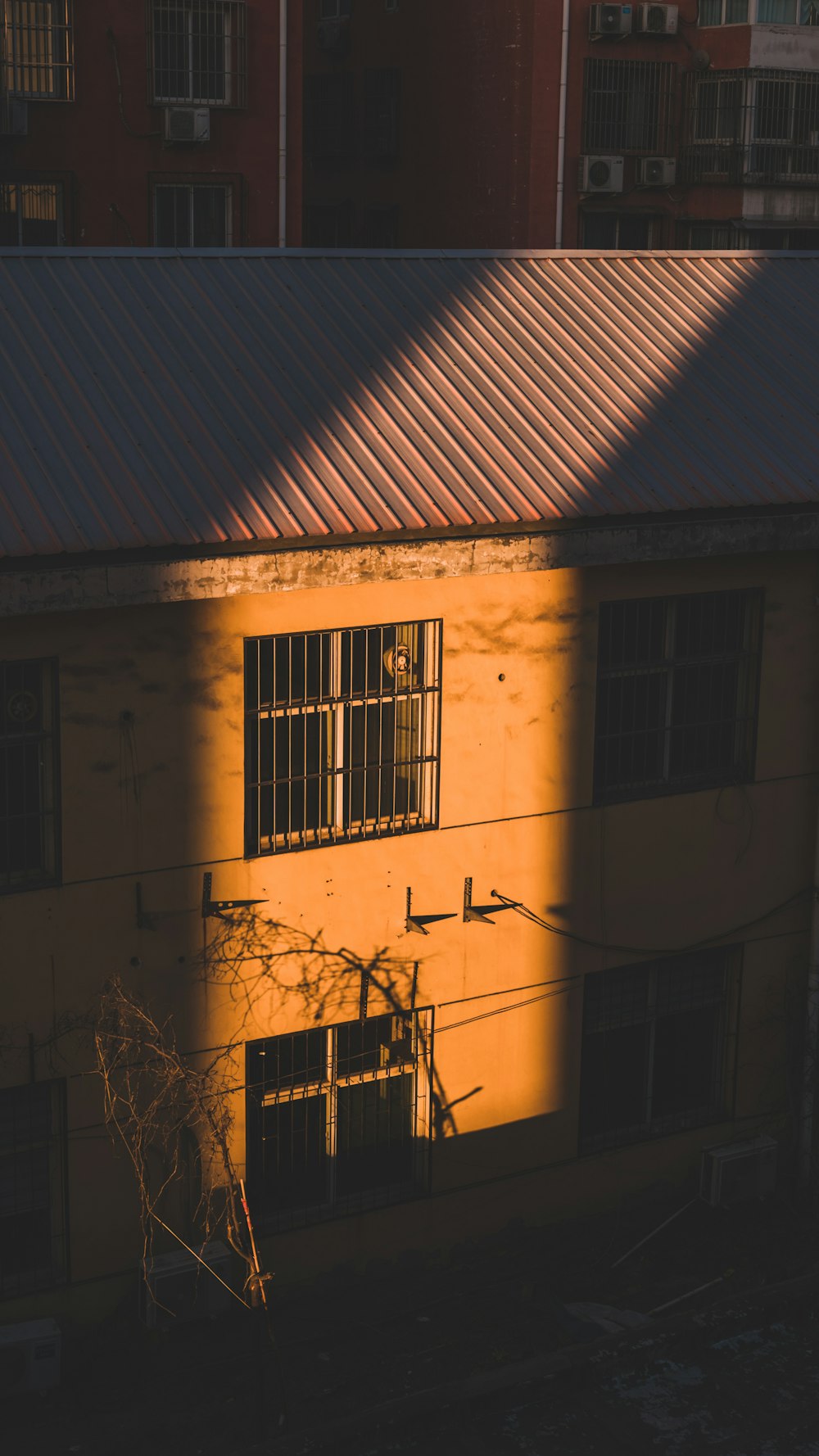 the shadow of a building on the ground