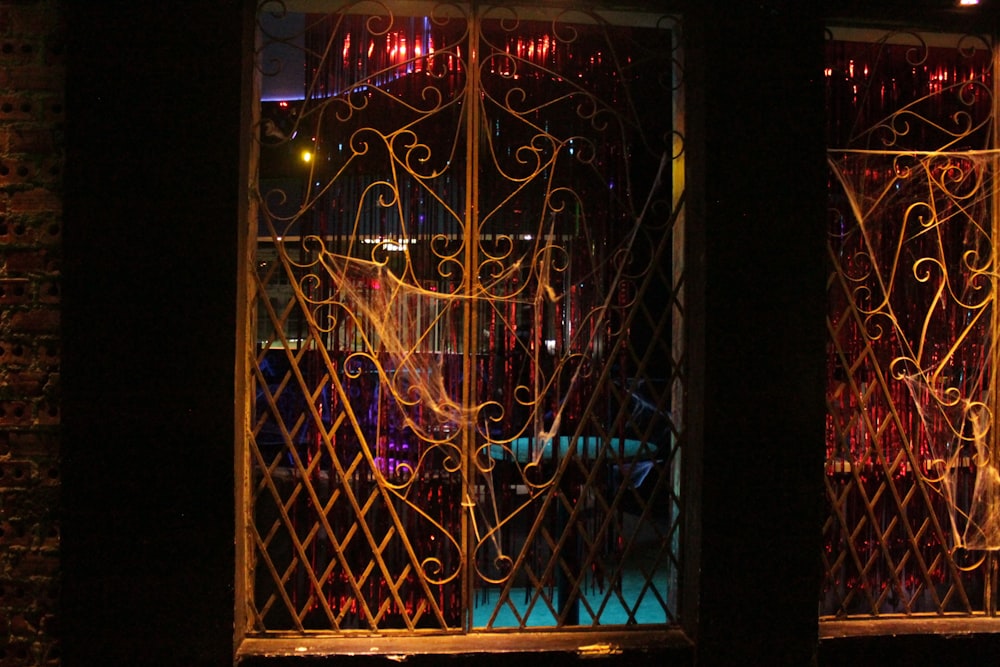 a view of a building through a window at night