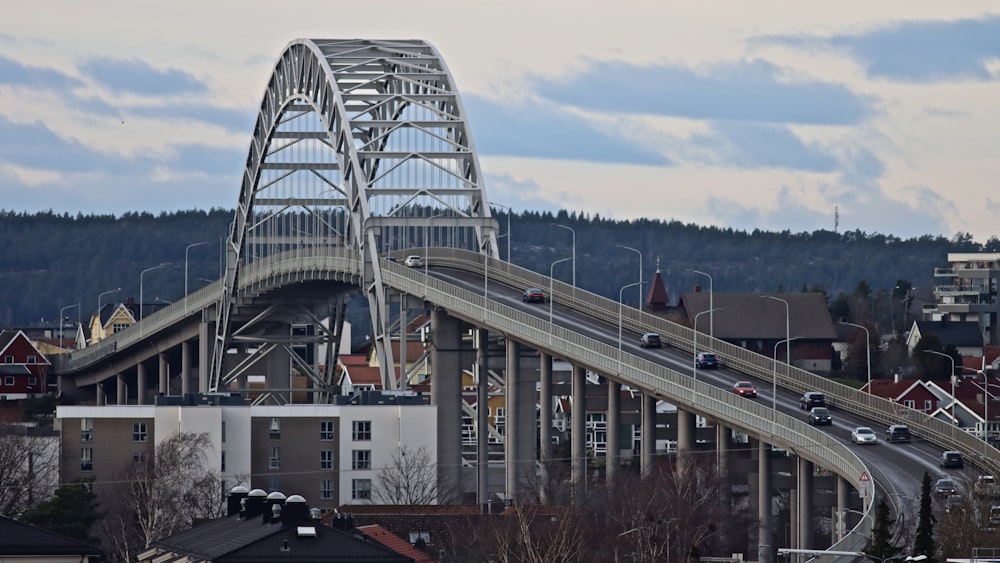 a bridge with cars going over it on a cloudy day