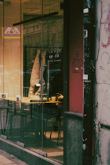A cozy urban café scene with people chatting and laughing, symbolizing casual connections.