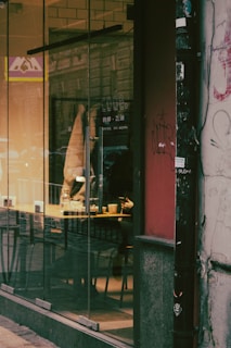 A cozy café with people chatting and sipping coffee.