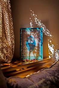 a picture frame sitting on top of a wooden table