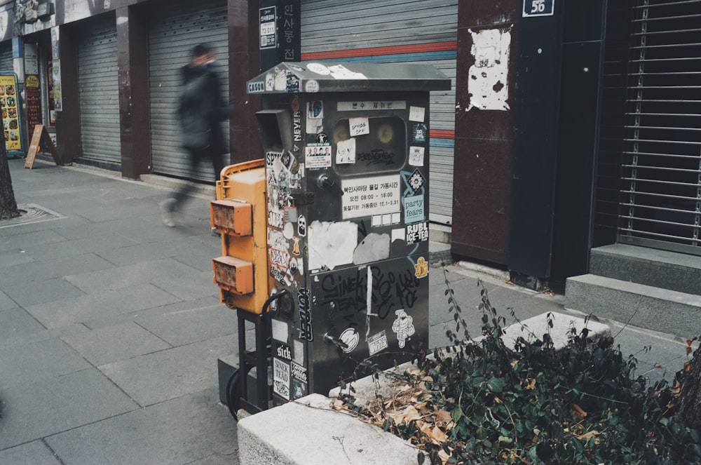 a street scene with a person walking on the sidewalk